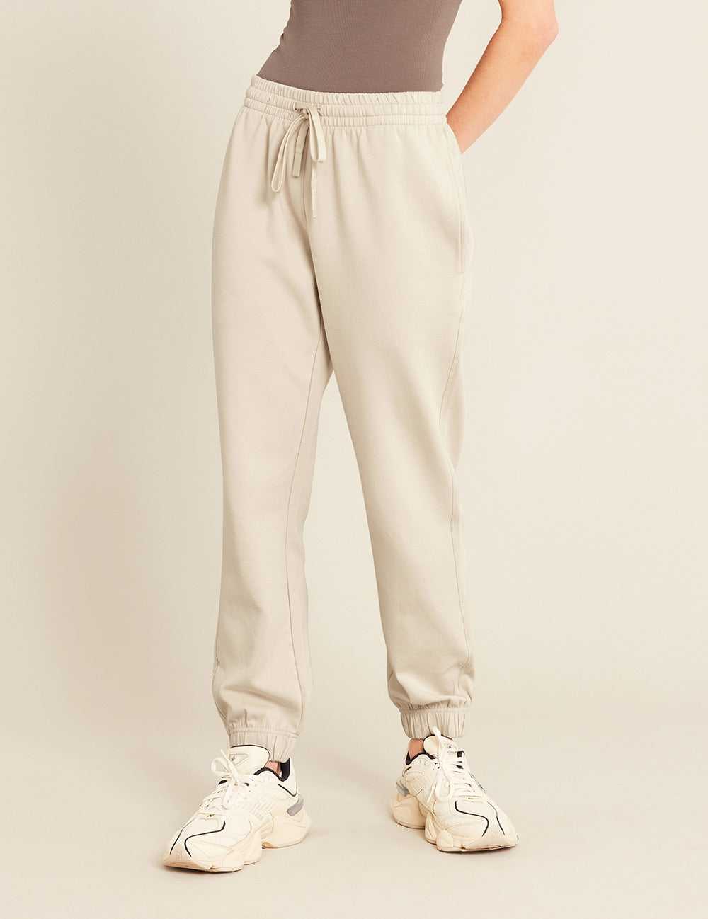 Gender-Neutral-Cuffed-Sweat-Pants-Sand-Female-Front.jpg